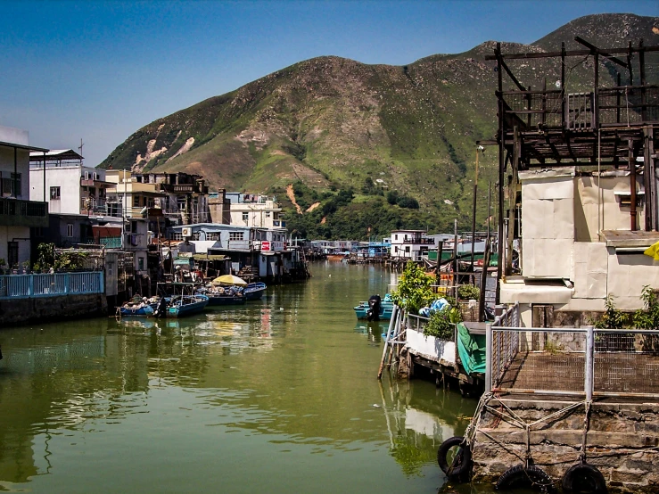 the view down a narrow river showing lots of houses