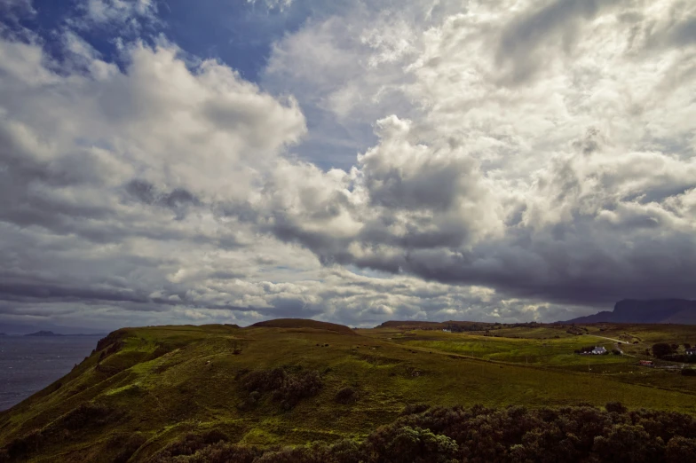 a lonely, deserted island sits amid the cloudy sky