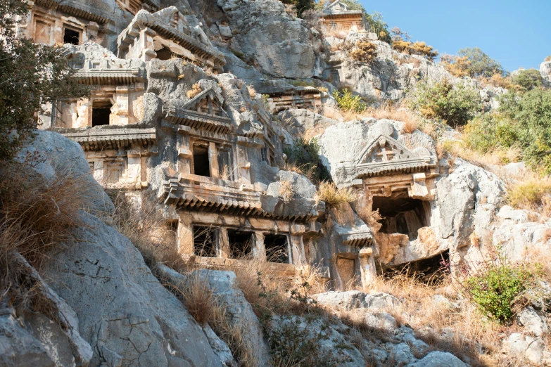 a stone structure with many small rooms built on top of it