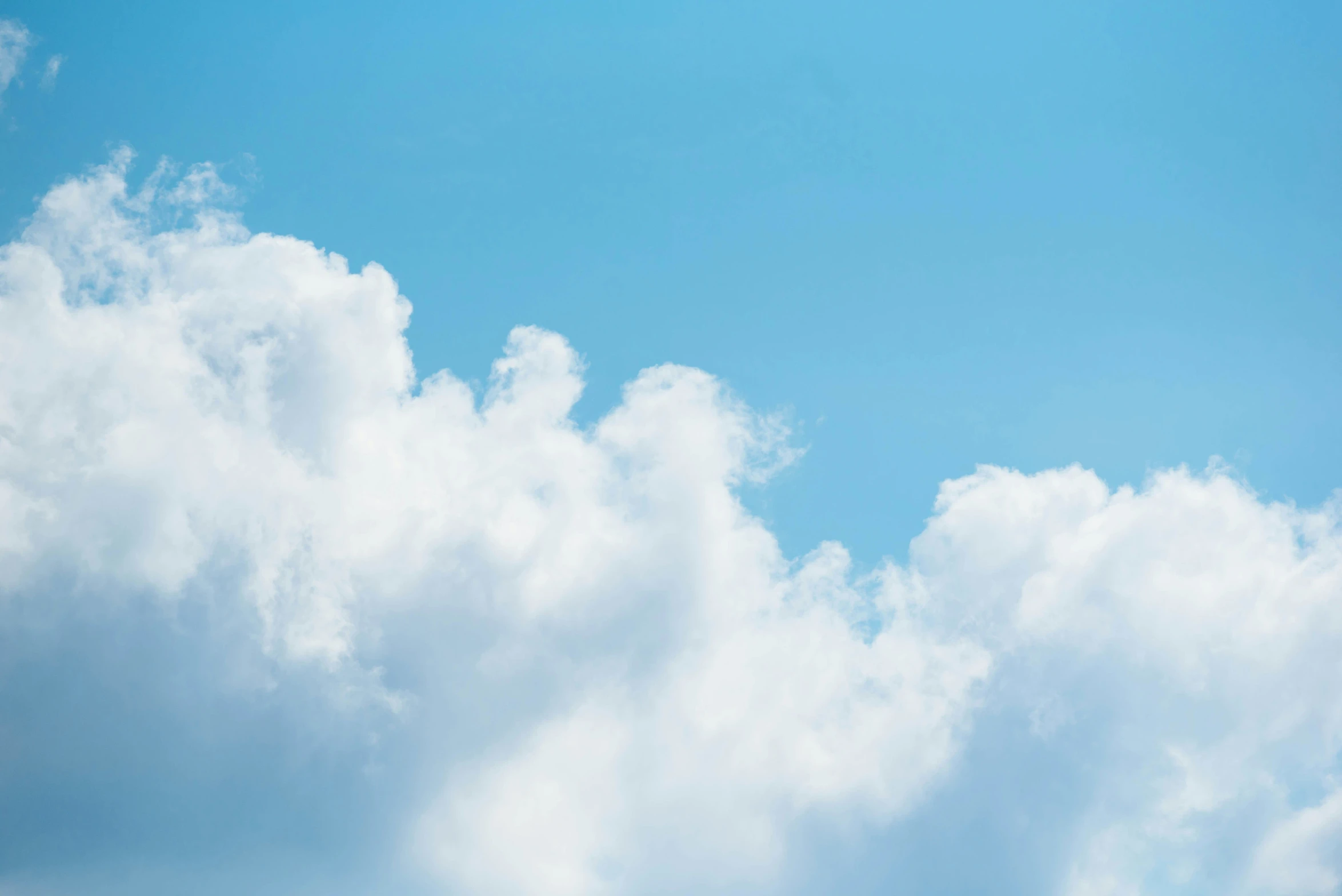 airplane in the sky with clouds below