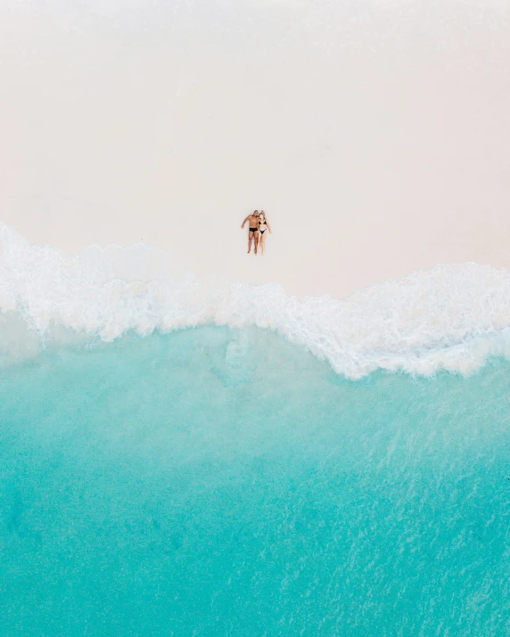 an overhead view of people in the water