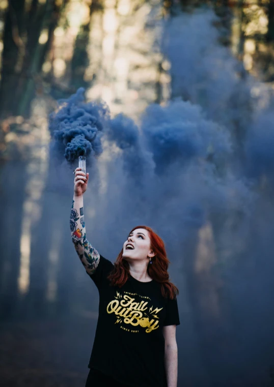 woman with blue smoke coming out of her mouth