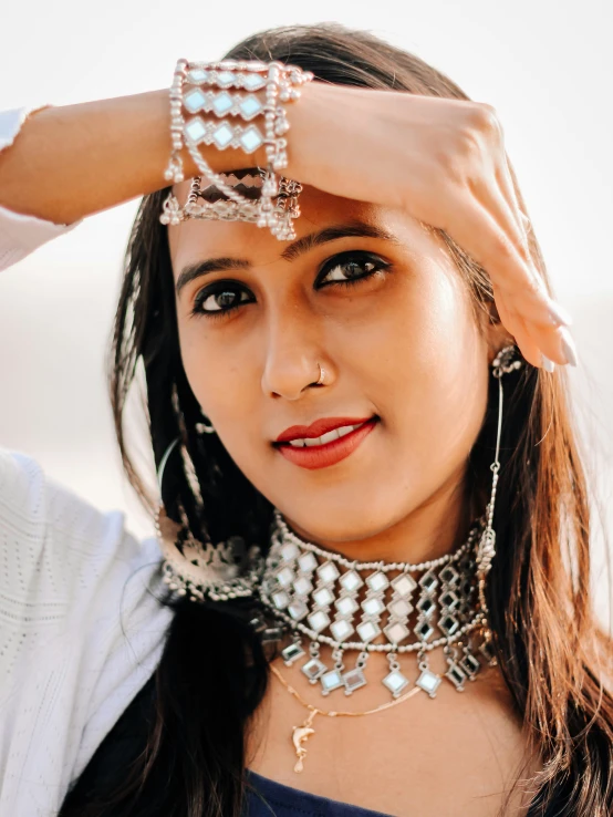 an indian woman wearing a very unique necklace