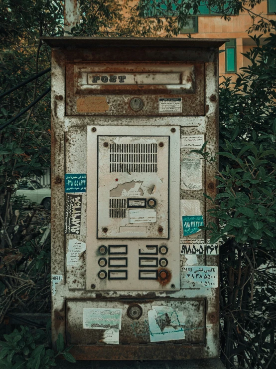 old machine with some tags on it outside