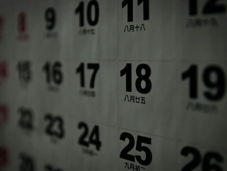 a calendar is decorated with asian numbers