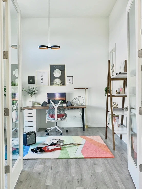 a room filled with furniture and a computer