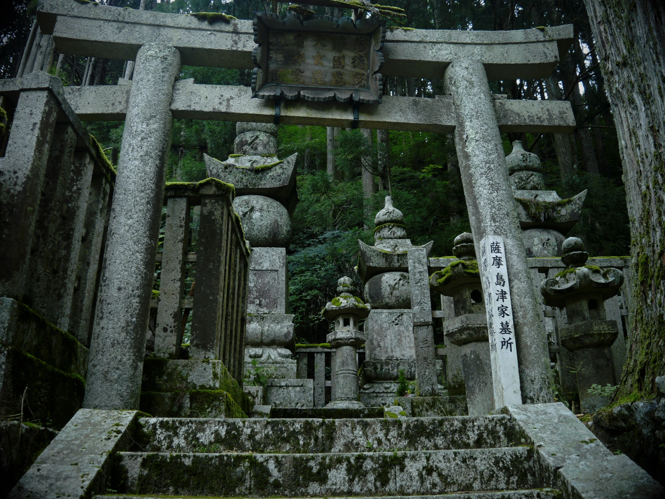 a very large old shrine with some statues and a shrine box