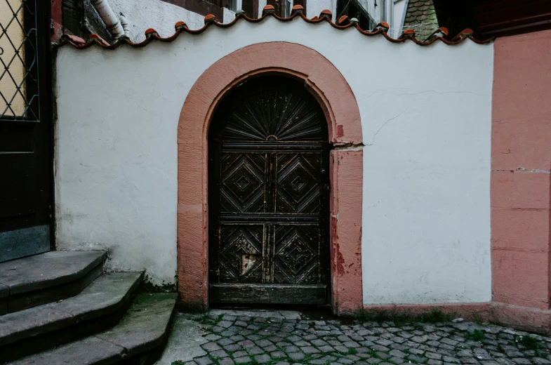 the entrance to a large building with brick steps