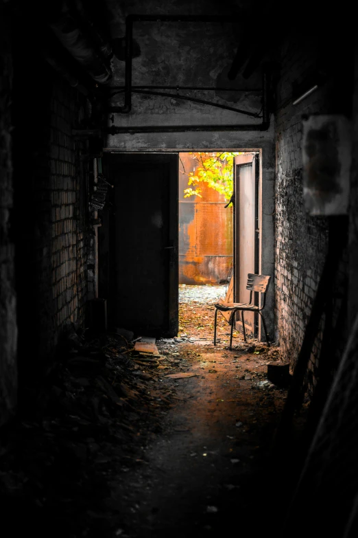 an alley way that has a rocking chair in the doorway