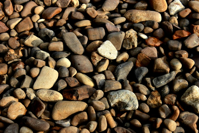 there is a lot of different colors and shapes of rocks on this beach