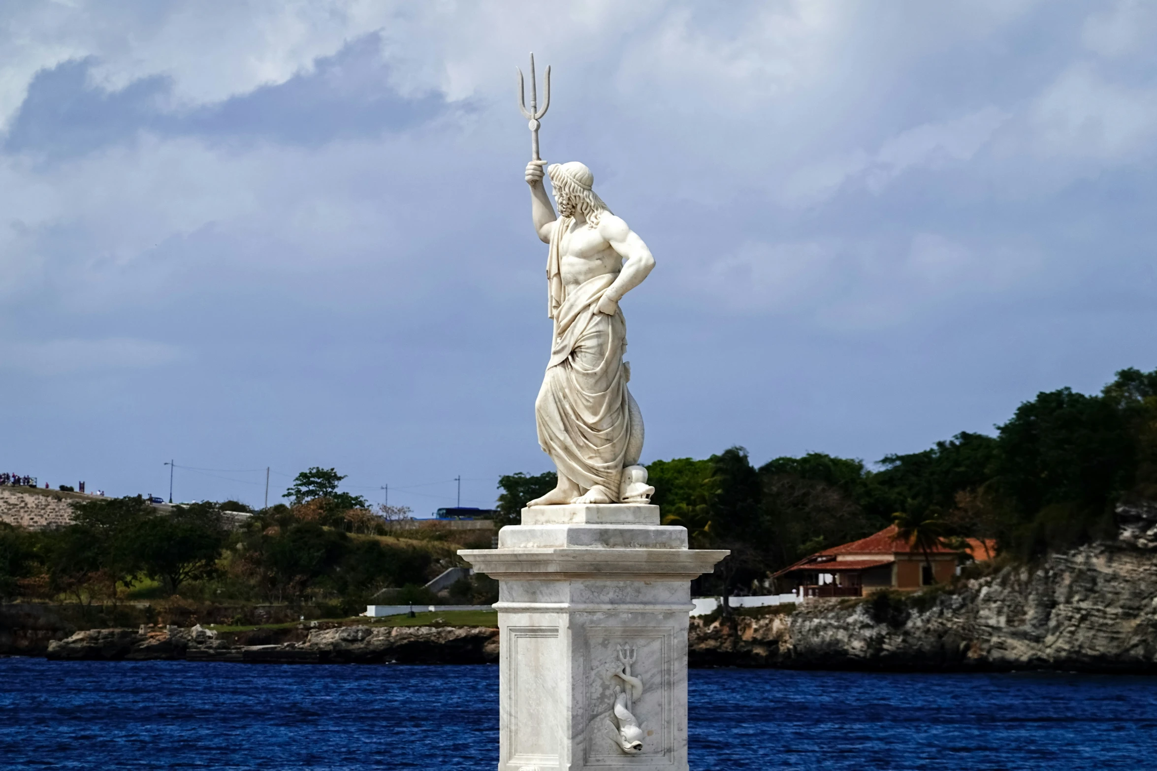 a statue of a woman on a bridge