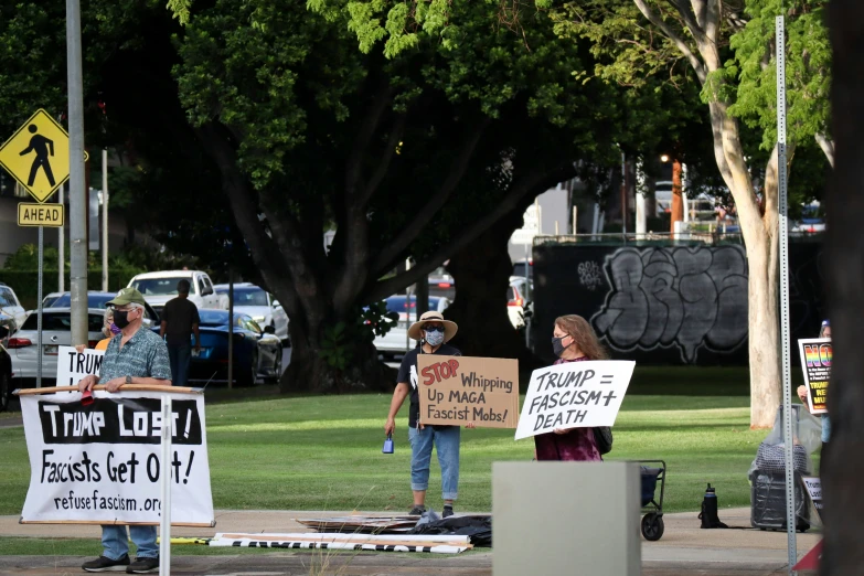 protesters holding signs for the occupy movement