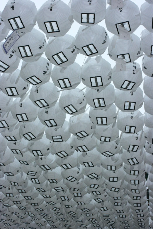 some paper hats are hung in the air