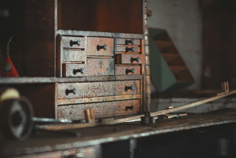 an old dresser sits on top of a table