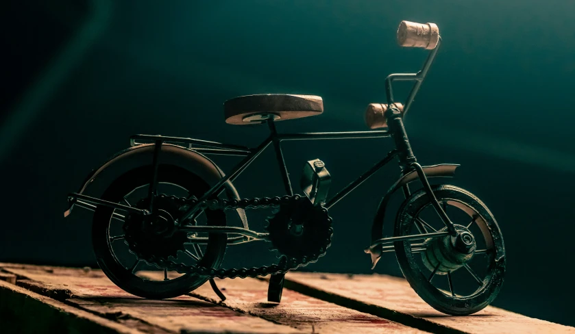 a black bicycle is shown on the ground