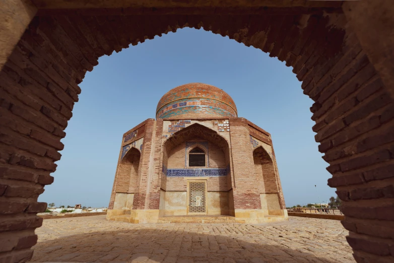 an archway to an old building on the beach