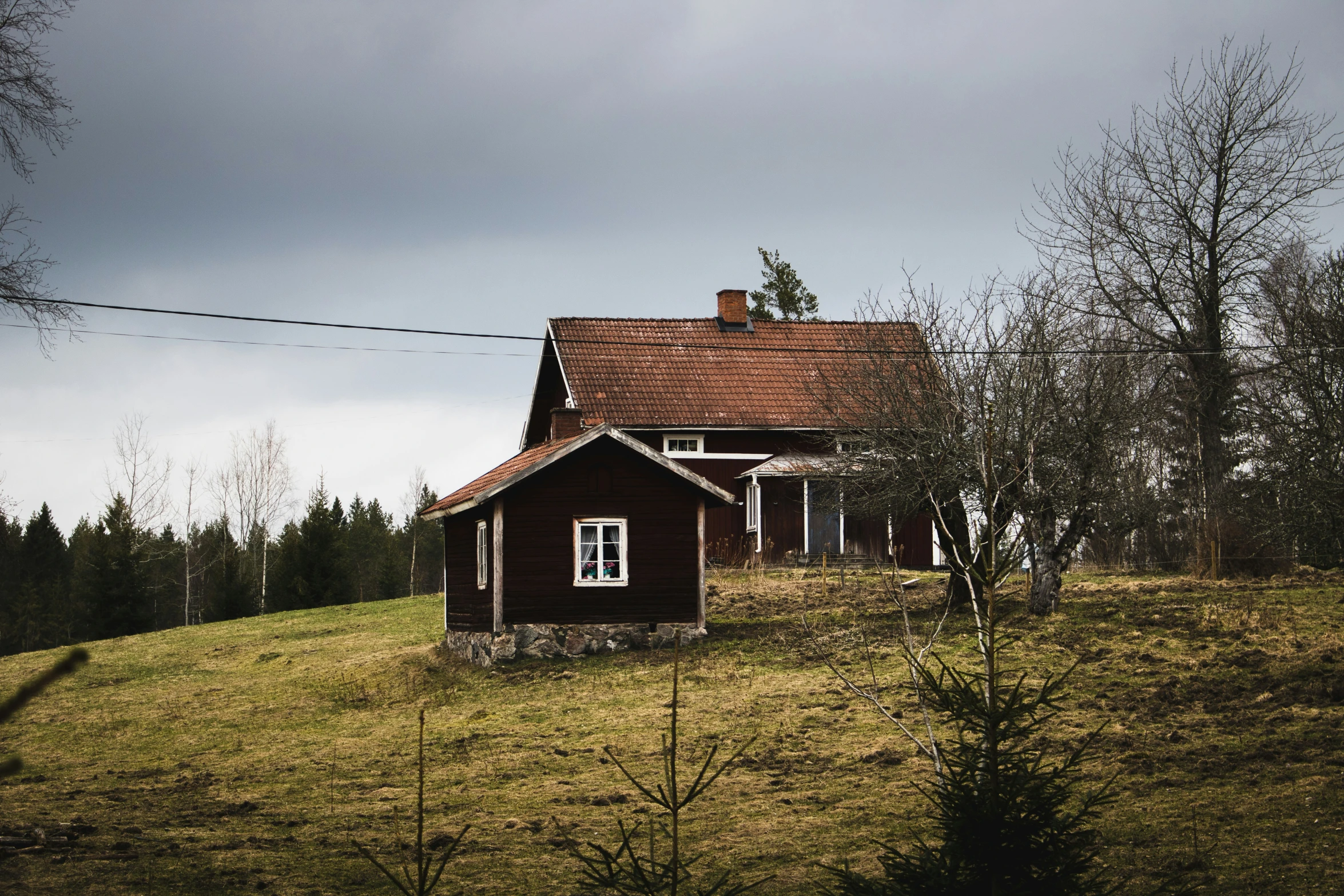 a brown building sitting on the side of a hill