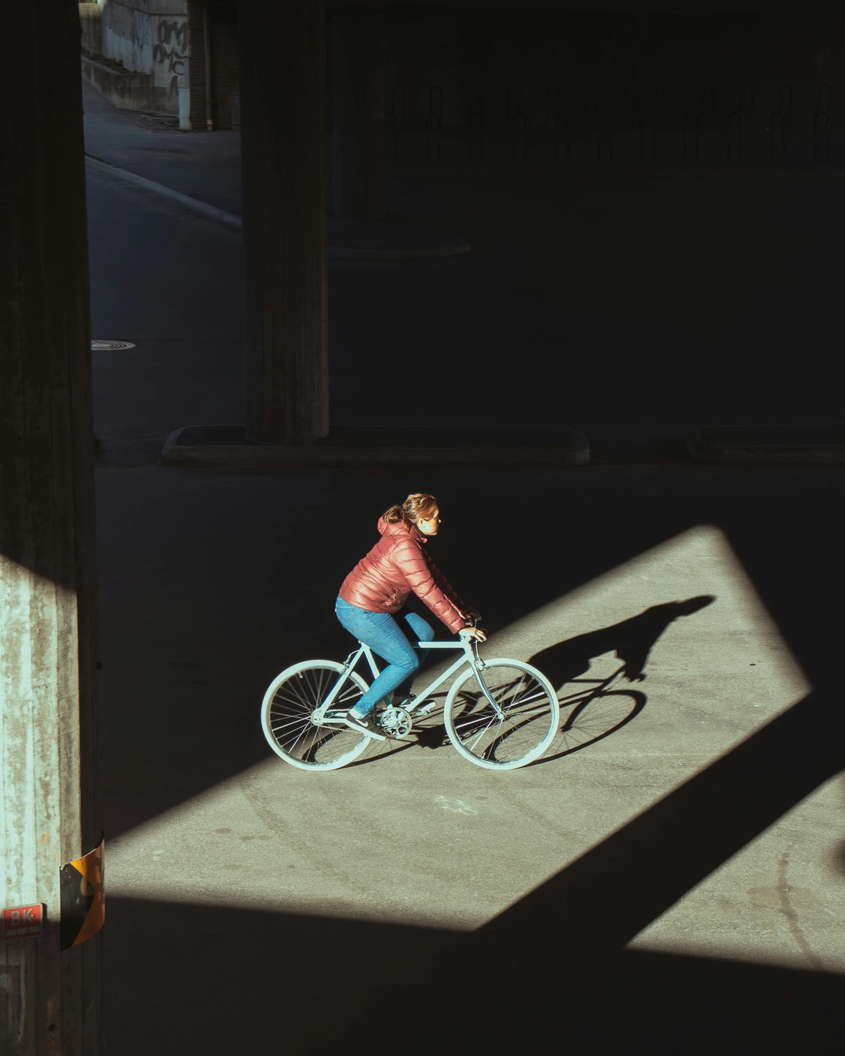 a woman riding on top of a bicycle