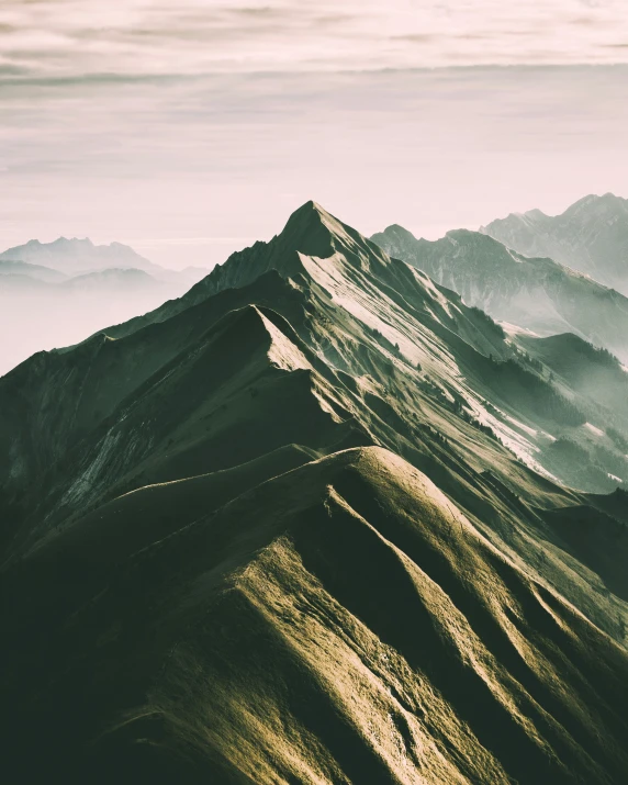 an area with some very tall mountains with a view into the distance