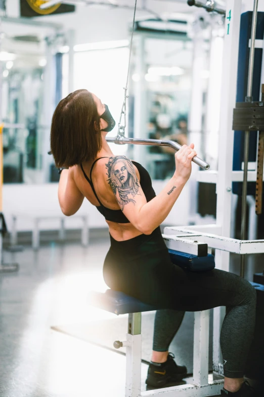 the woman is practicing doing different tasks in the gym