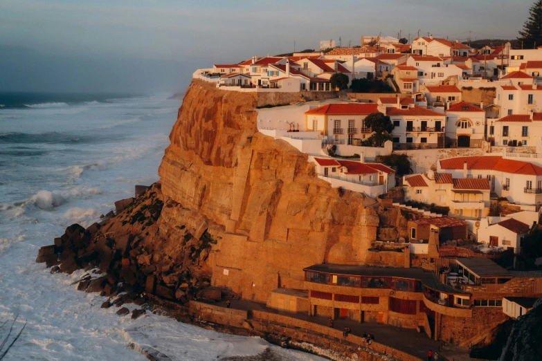 houses in a cliff next to the ocean