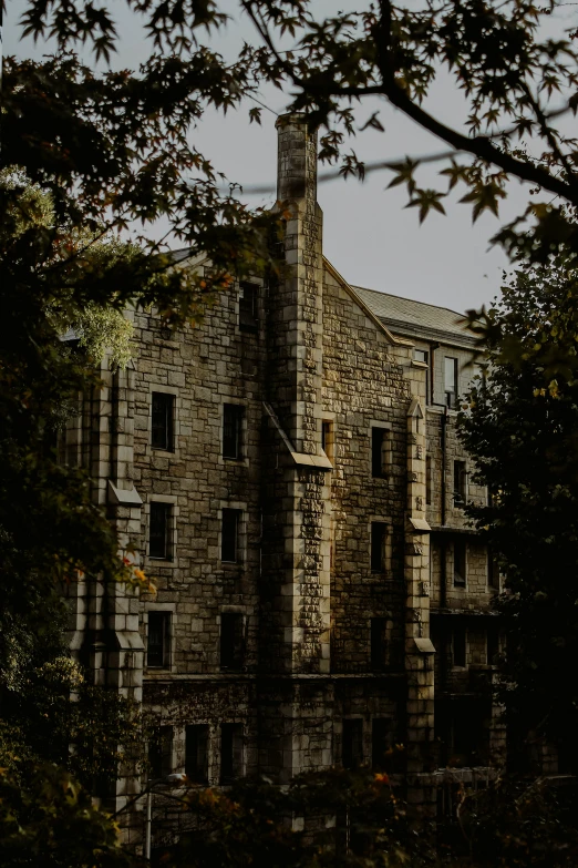 an old looking building with a clock on it