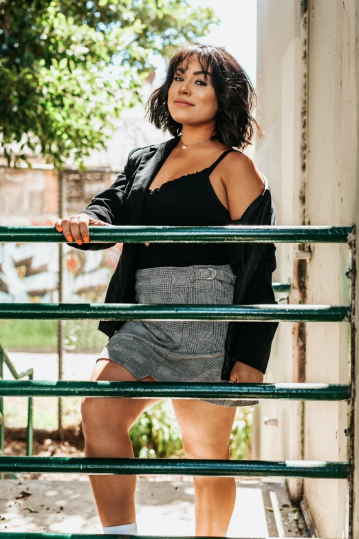 a woman in black shirt standing on stairs