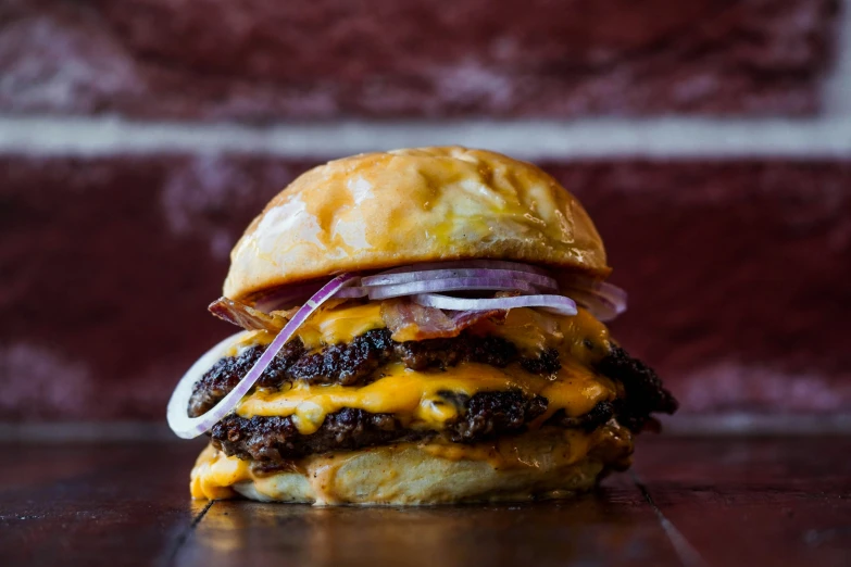 a hamburger on top of a wooden counter