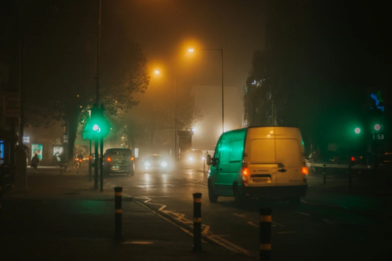 streetlights shine in the dark, overcast night