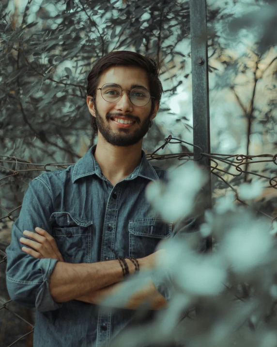 a guy smiling and looking at the camera