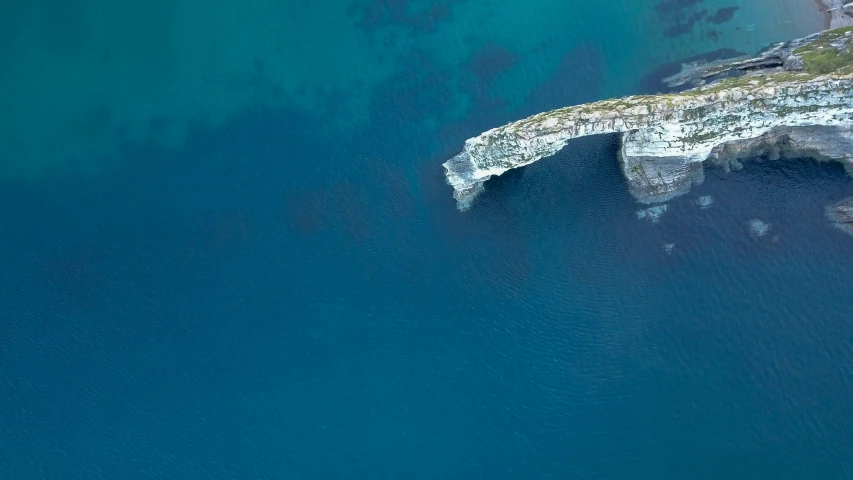 a view of the coastline and cliffs in the water