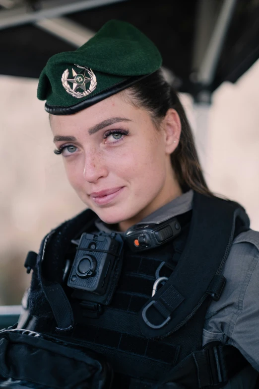 an officer is smiling for a po wearing her uniform