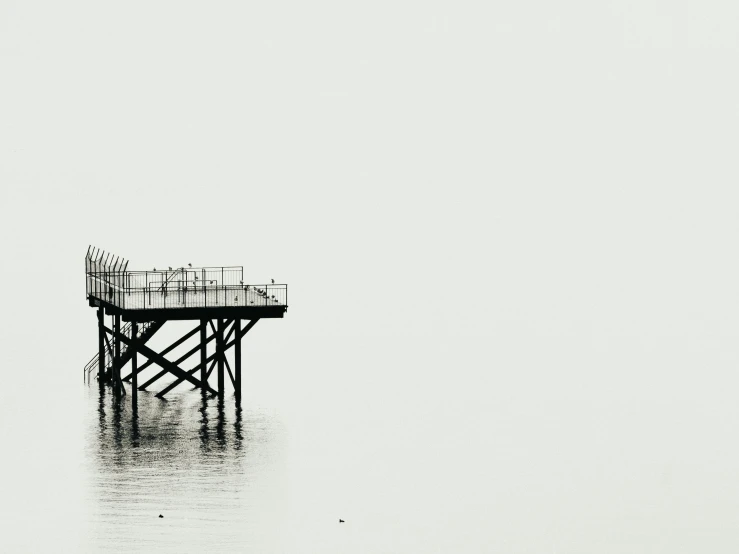 a black and white po of a pier