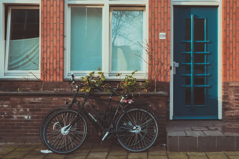 a bike with flower boxes placed in front of the windows