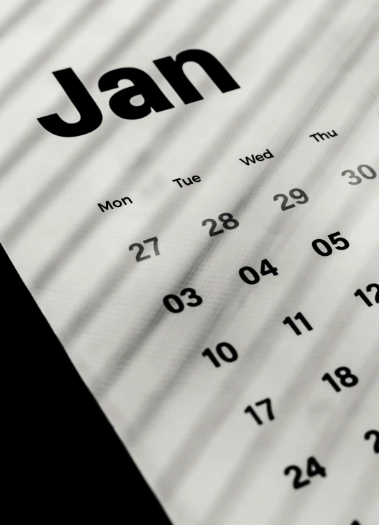 a table calendar sitting on top of a desk