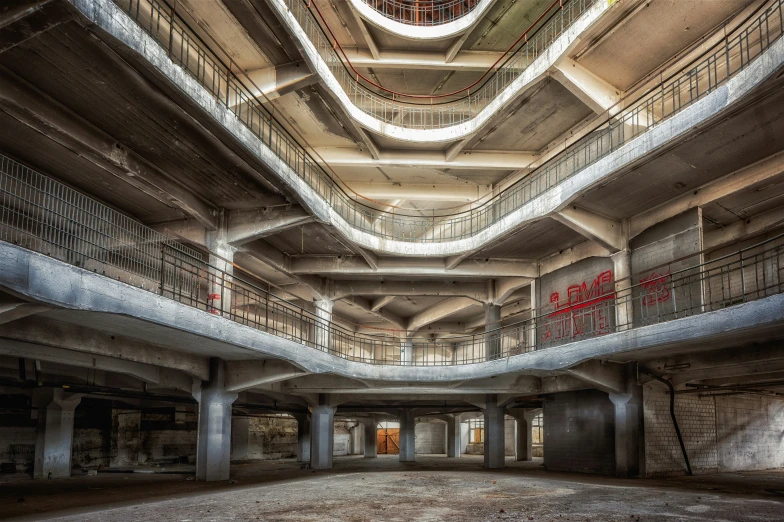 inside an abandoned building with balconies and no doors