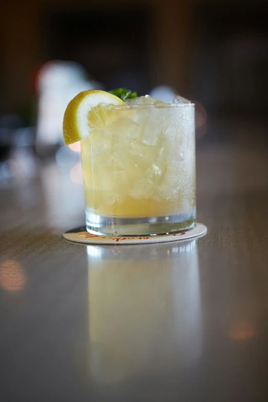 a lemon and basil cocktail on the bar