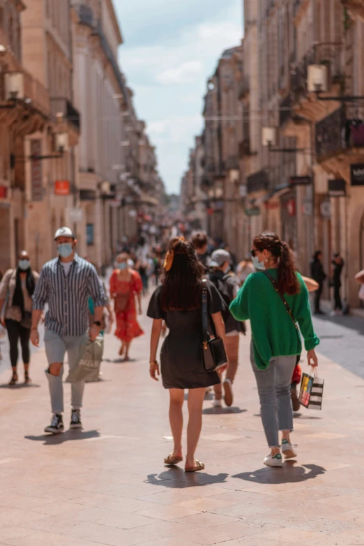 people walking on the street during the day