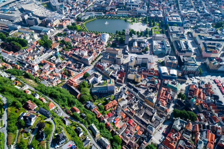 an aerial view of a city with a river running next to it