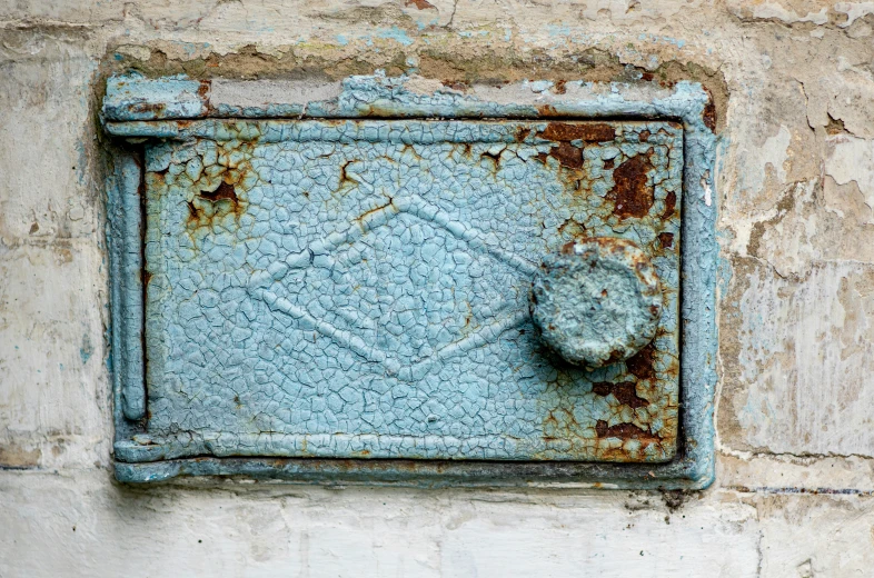 rusted square plate with a decorative design on the outside