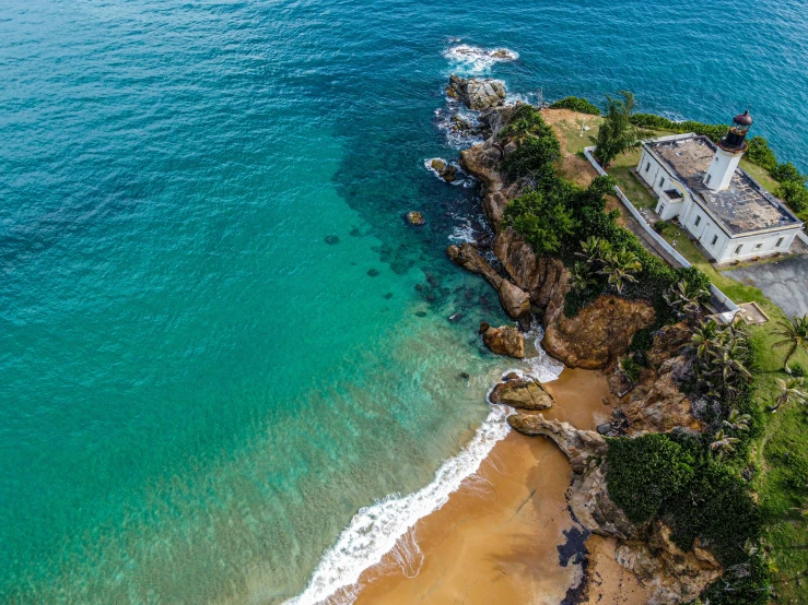 an aerial s of a home by the ocean