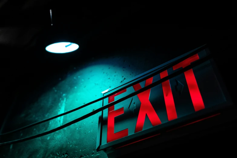 an exit sign is lit up at night