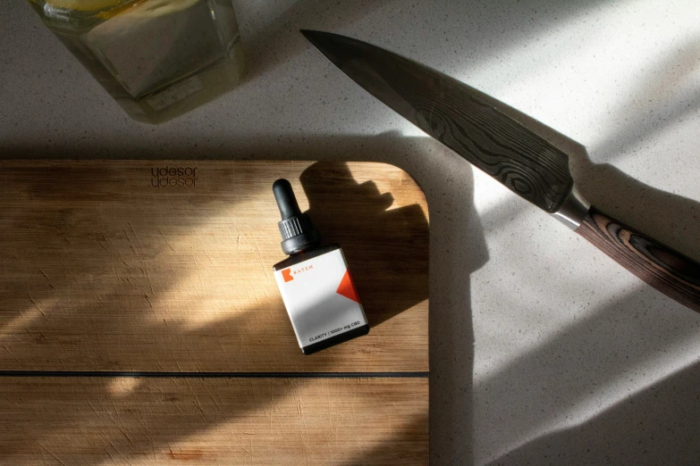 a knife on top of a  board with a sticker