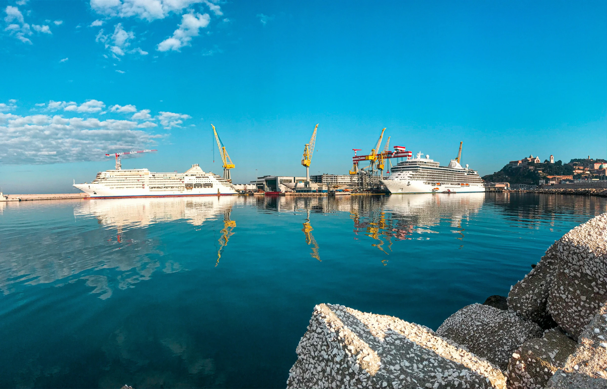 the ships are docked by the shore in the marina