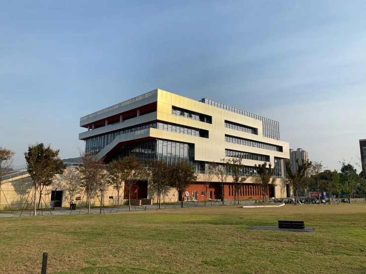 a very big building in the middle of a field