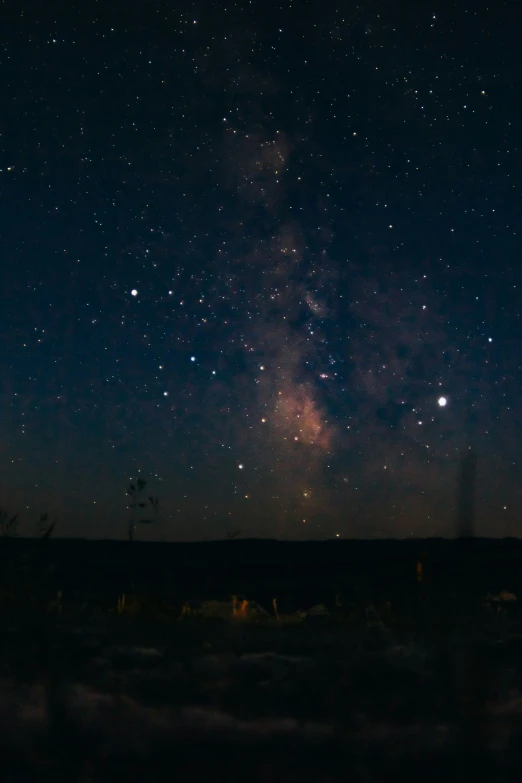 a dark sky with lots of stars in it