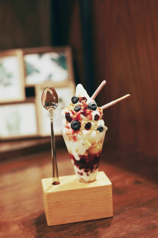 an ice cream sundae with berries, and strawberries