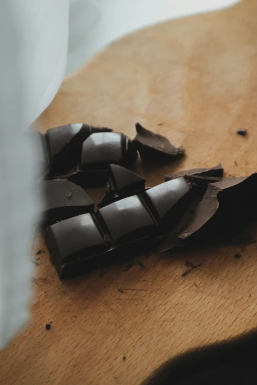 pieces of chocolate are laying on top of the table