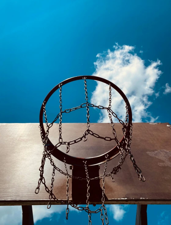 a basketball hoop with chains hanging down from it