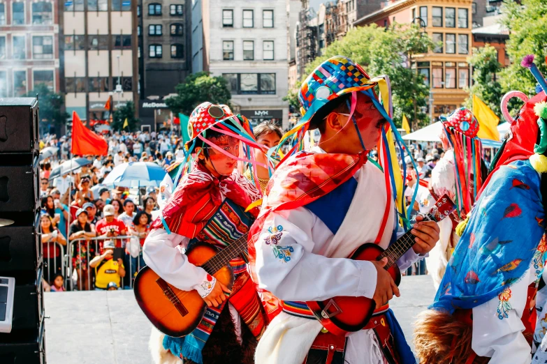 men dressed in colorful costumes at a parade